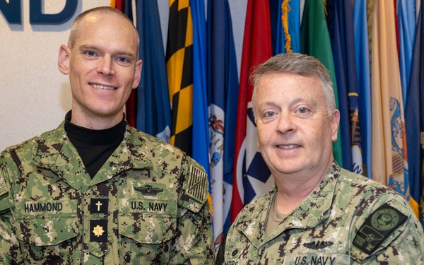 RADM Waters gives Bravo Zulu belt buckles to Chaplains