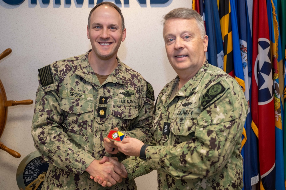 RADM Waters gives Bravo Zulu belt buckles to Chaplains