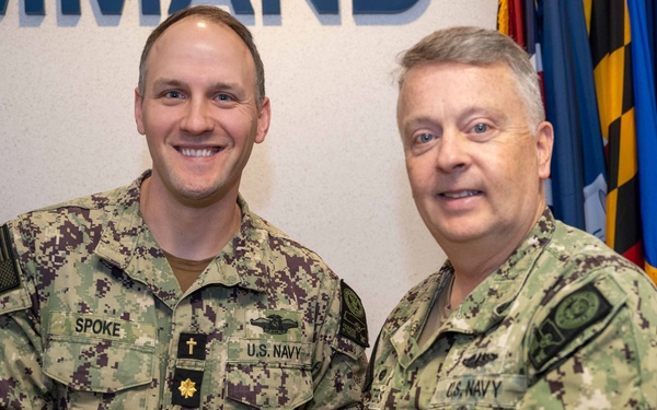 RADM Waters gives Bravo Zulu belt buckles to Chaplains