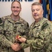RADM Waters gives Bravo Zulu belt buckles to Chaplains