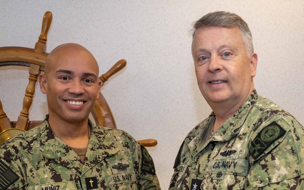 RADM Waters gives Bravo Zulu belt buckles to Chaplains