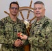 RADM Waters gives Bravo Zulu belt buckles to Chaplains