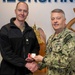 RADM Waters gives Bravo Zulu belt buckles to Chaplains