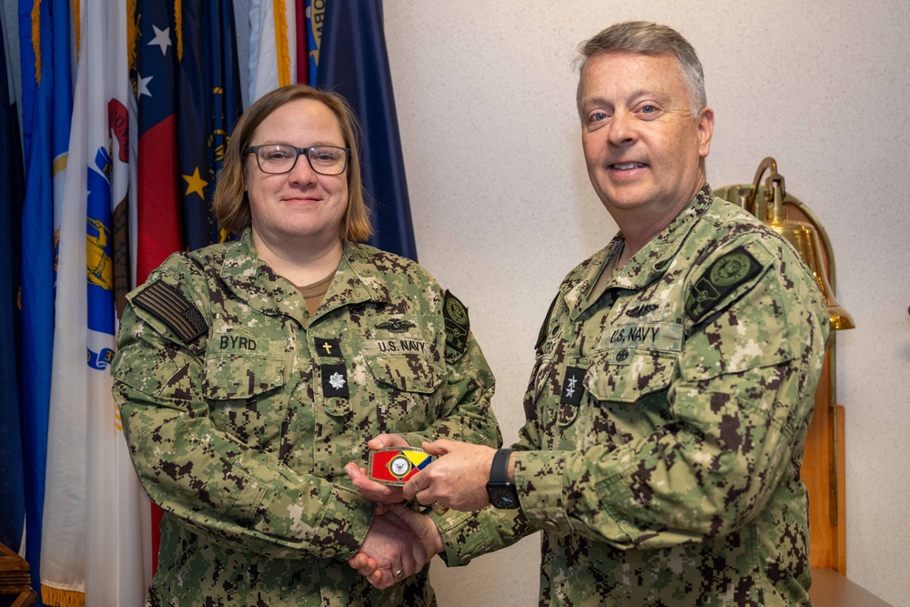 RADM Waters gives Bravo Zulu belt buckles to Chaplains