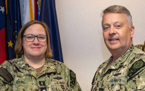 RADM Waters gives Bravo Zulu belt buckles to Chaplains