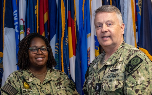 RADM Waters gives Bravo Zulu belt buckles to Chaplains