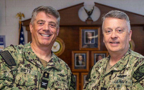 RADM Waters gives Bravo Zulu belt buckles to Chaplains
