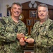 RADM Waters gives Bravo Zulu belt buckles to Chaplains
