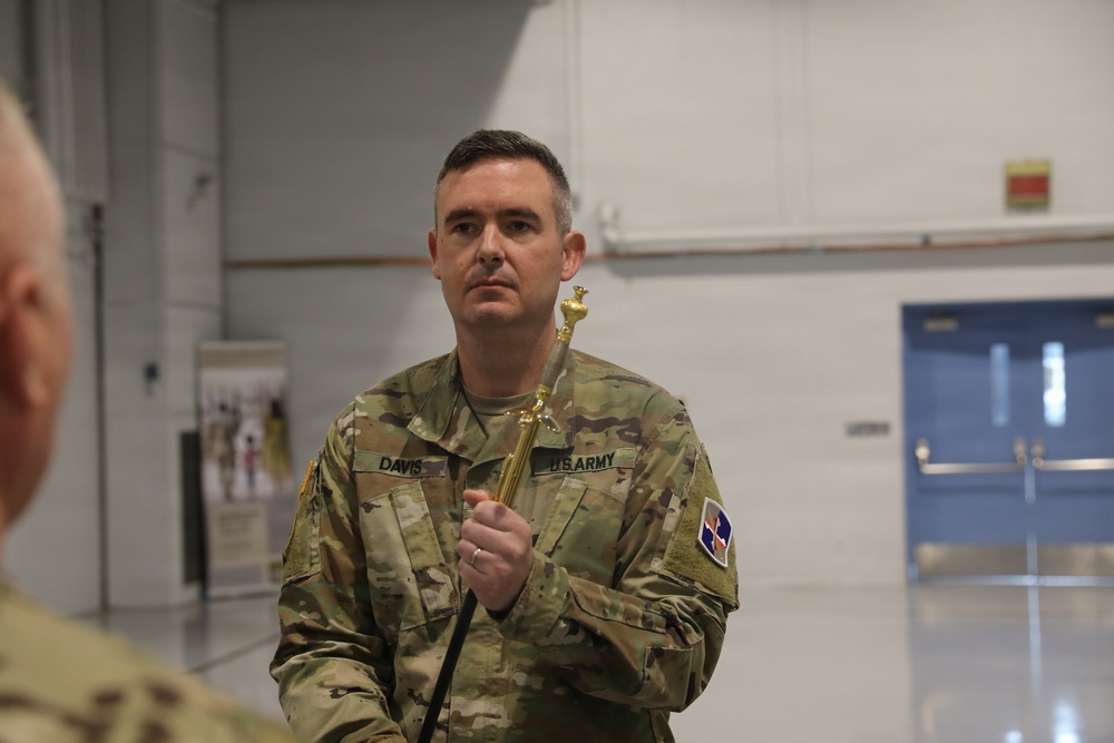 Command Sgt. Maj. Benjamin Davis takes responsibility for the 58th Expeditionary Military Intelligence Brigade