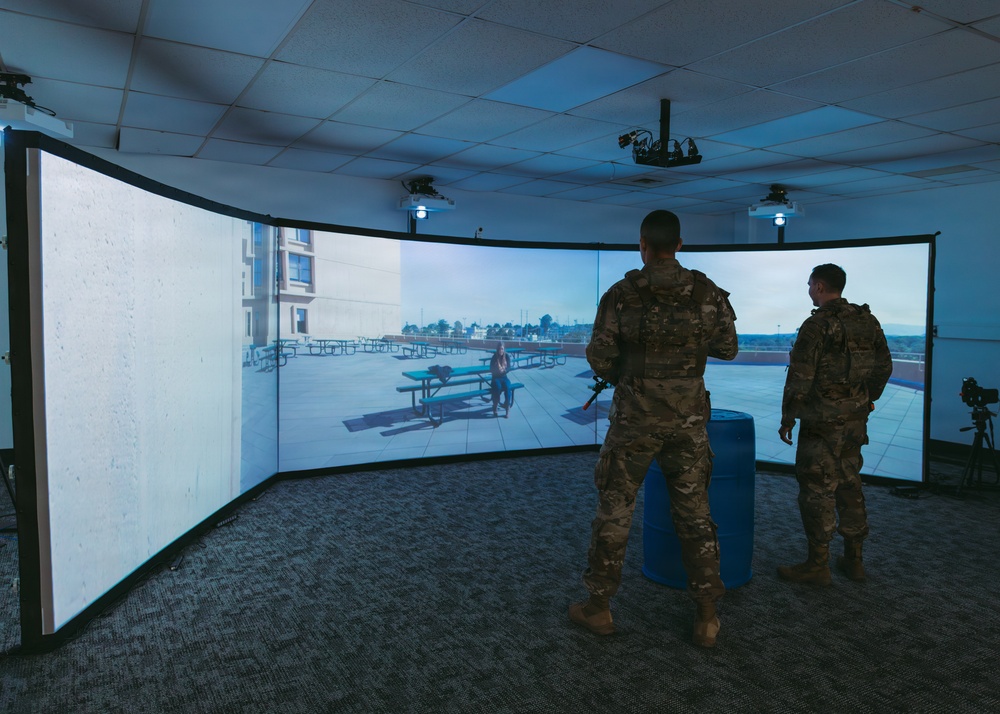 Airmen of the 139th Security Forces Squadron train with firearms simulator