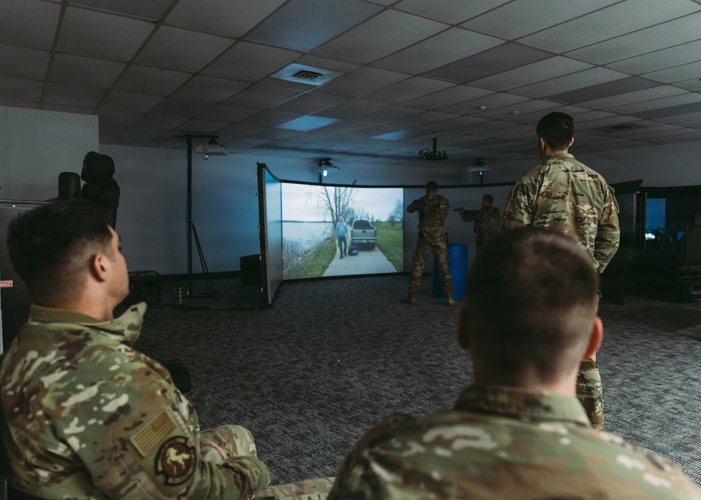 Airmen of the 139th Security Forces Squadron train with firearms simulator