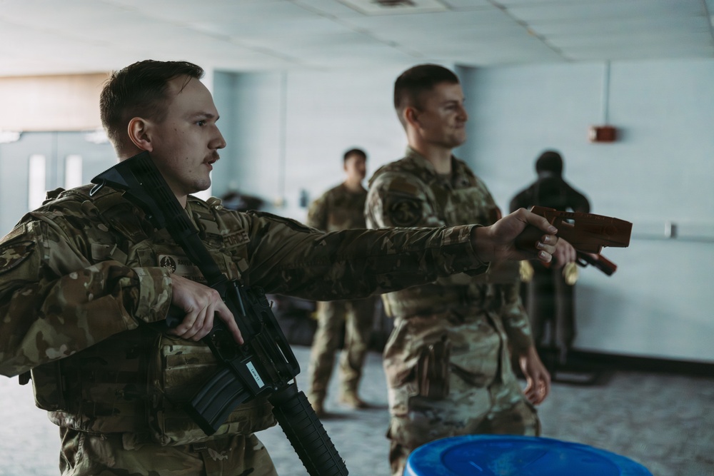 Airmen of the 139th Security Forces Squadron train with firearms simulator