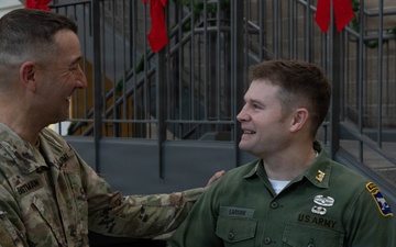 Army Maj. Wears Father's Utility Uniform During Promotion Ceremony