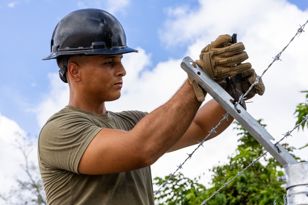 NMCB 133 Builds New Security Fence and Access Road