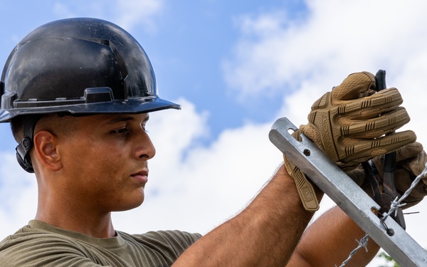 NMCB 133 Builds New Security Fence and Access Road
