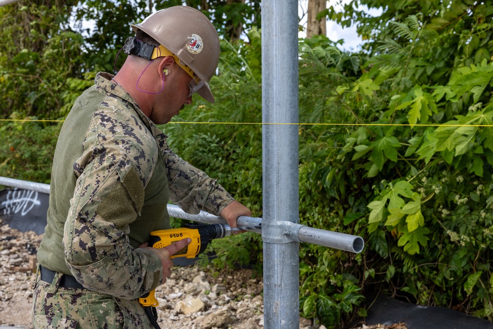 NMCB 133 Builds New Security Fence and Access Road