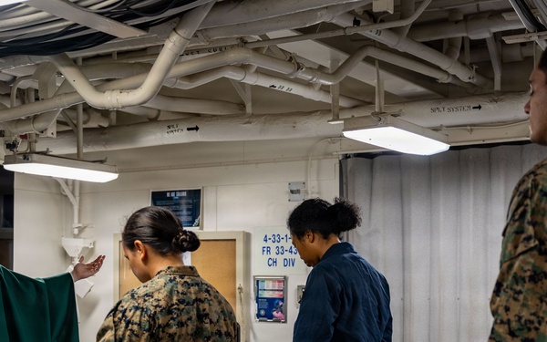 USS San Antonio (LPD 17) hold catholic mass and congradulates the 'Defender of the Day'