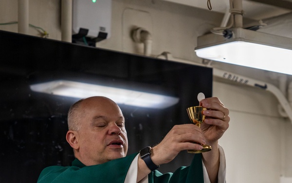 USS San Antonio (LPD 17) hold catholic mass and congradulates the 'Defender of the Day'