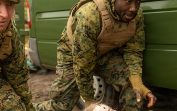 U.S. Navy Sailors alongside Finnish service members execute a simulated mass casualty response