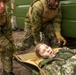 U.S. Navy Sailors alongside Finnish service members execute a simulated mass casualty response