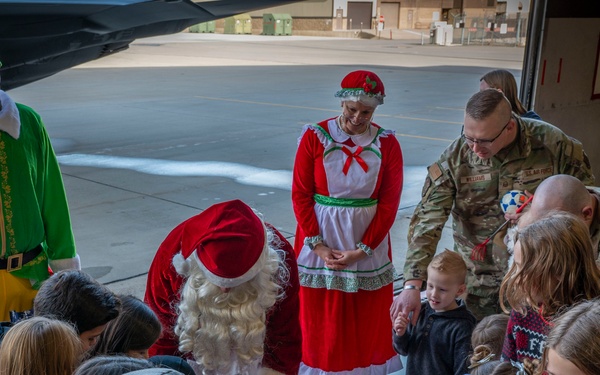 Santa arrives at 419th Family Holiday Party