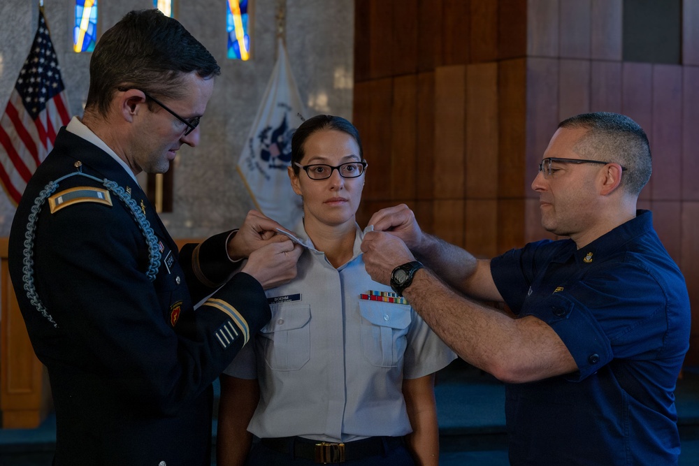MST1 Alexandra Boehm, a reservist assigned to Sector New York, is meritoriously advanced during an all-hands event.