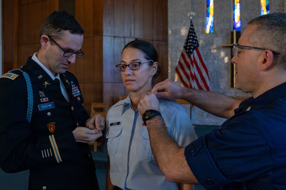 MST1 Alexandra Boehm, a reservist assigned to Sector New York, is meritoriously advanced during an all-hands event.