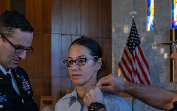 MST1 Alexandra Boehm, a reservist assigned to Sector New York, is meritoriously advanced during an all-hands event.