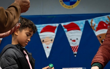 Team Minot celebrates the Minot Air Force Base Christmas Tree Lighting ceremony