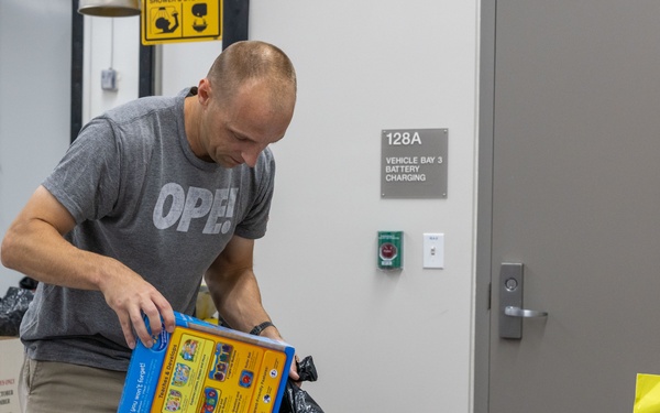 Service members help sort toys for Toys for Tots 2025