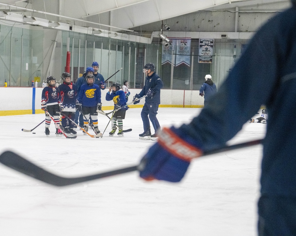 U.S. Coast Guard Academy cadets help train youth hockey team