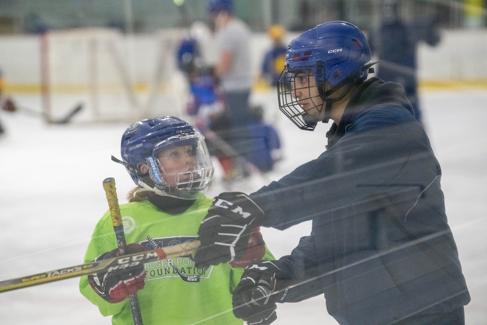 U.S. Coast Guard Academy cadets help train youth hockey team
