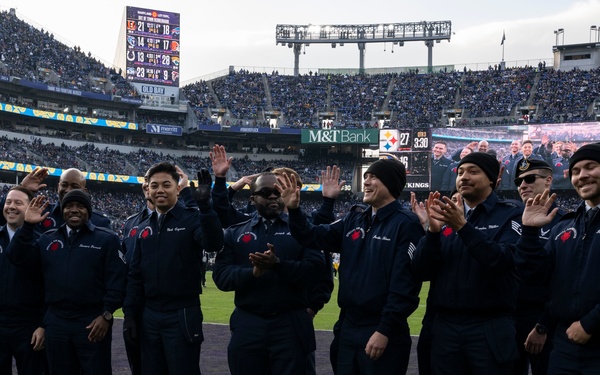 89th Airlift Wing conducts Ravens game flyover