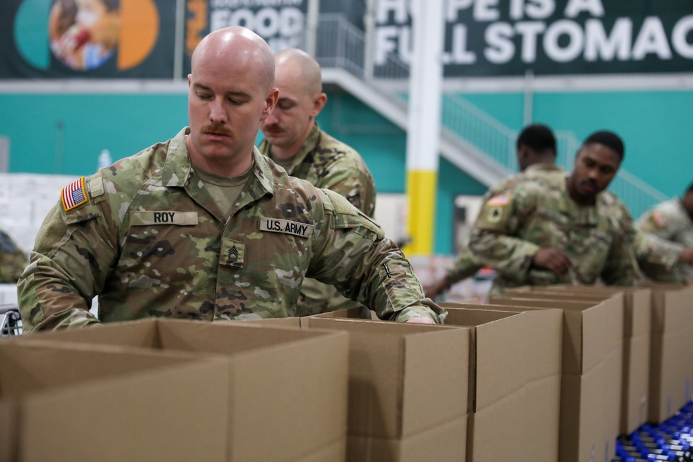 Guard Helps at Food banks