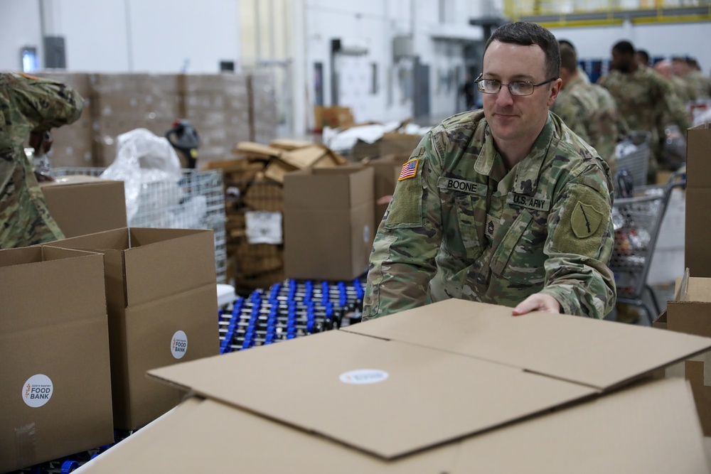 Guard Helps at Food banks