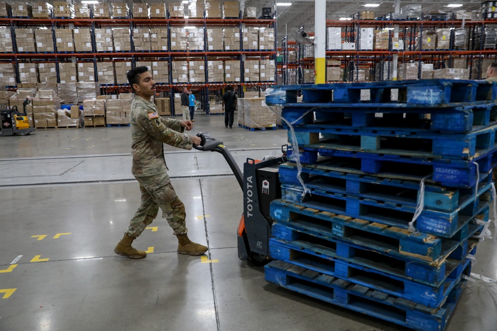 Guard Helps at Food bank