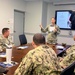 Senior Chief Constructionman Michael Ramey, from Commander Navy Region Hawaii, briefs Sailors on the Navy Wounded Warrior Program's mission to support service members throughout their recovery and return to duty or transition.