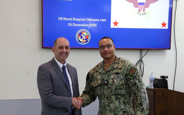 Japan (December 3, 2025) – During a visit Dec. 3, 2025, Acting Assistant Secretary of War for Health Affairs Dr. Stephen Ferrara recognizes Hospital Corpsman 2nd Class Steven Vialva