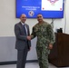 Japan (December 3, 2025) – During a visit Dec. 3, 2025, Acting Assistant Secretary of War for Health Affairs Dr. Stephen Ferrara recognizes Hospital Corpsman 2nd Class Steven Vialva