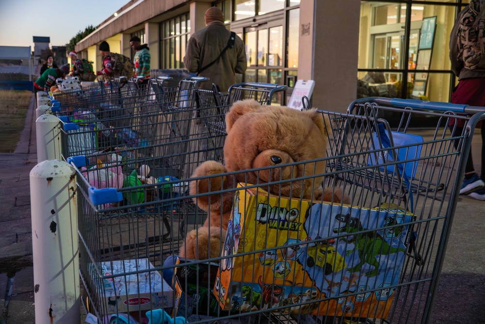 The First Team donates toys for Operation Holiday Cheer