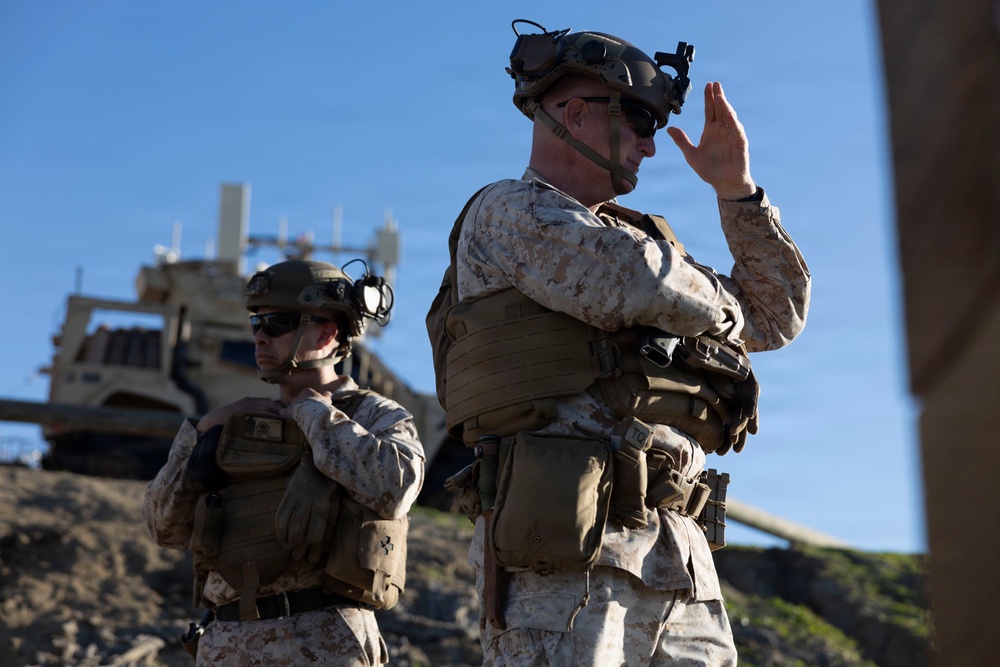U.S. Marines with FSB, 11th Marines call in close air support with HMLA-367