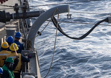 USS Dewey Completes a Replenishment-at-Sea with USS George Washington