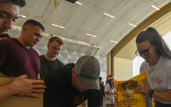 Operation Christmas Drop 2025 begins: Service members, families, volunteers flock to Andersen to support