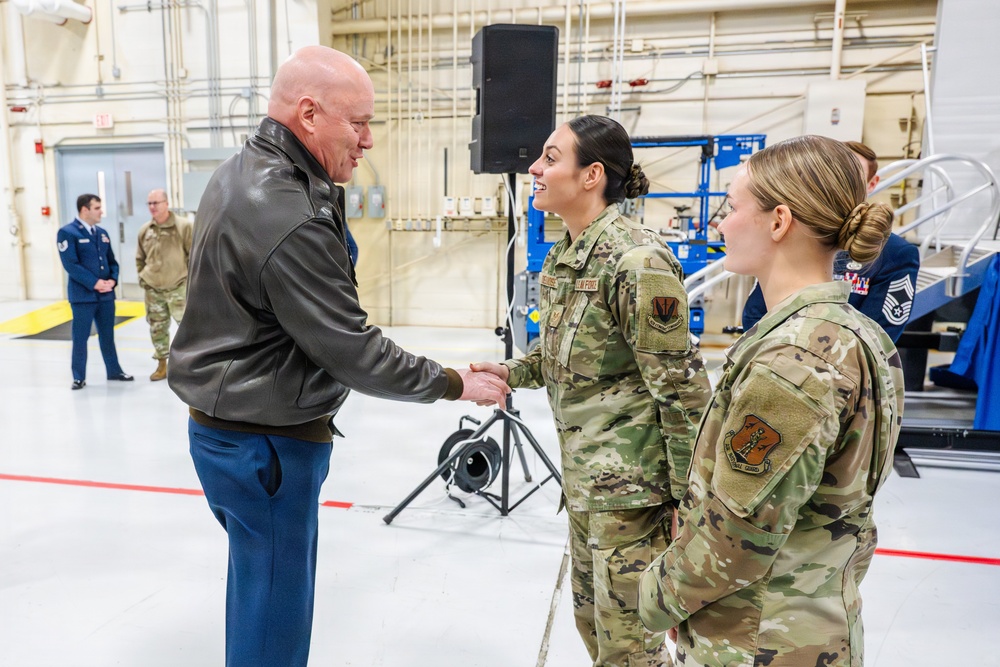Airmen of Year winners get coined by Maj. Gen McDonough.