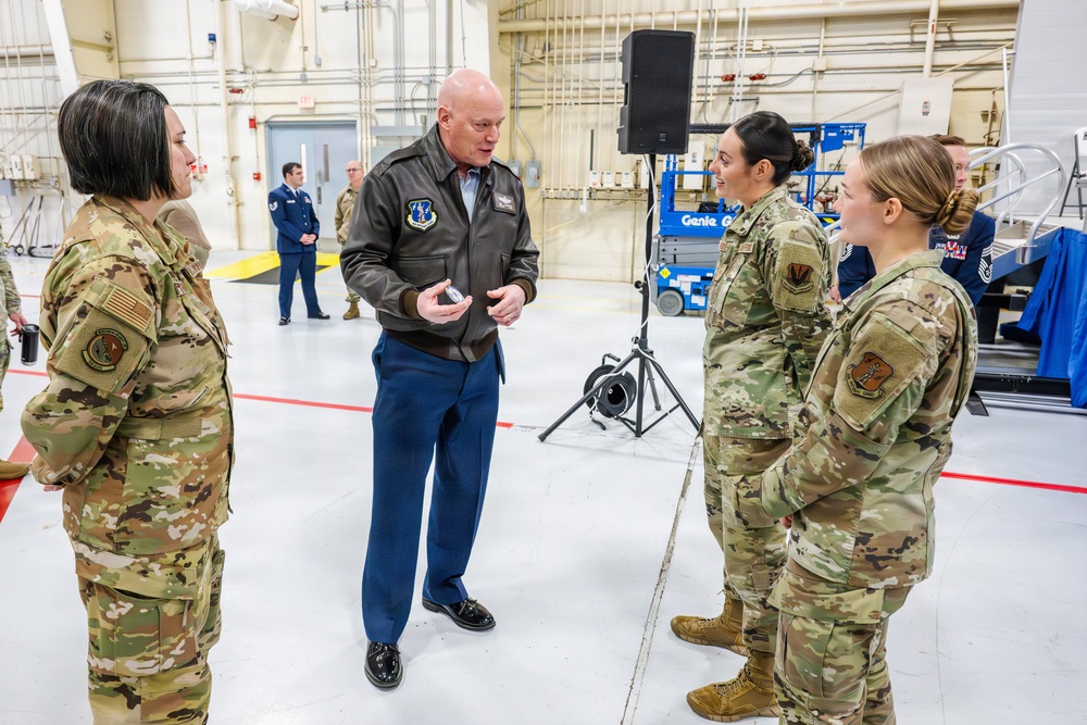 Airmen of Year winners get coined by Maj. Gen McDonough.
