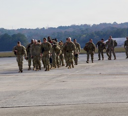 Soldiers walks on flight line