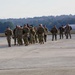 Soldiers walks on flight line