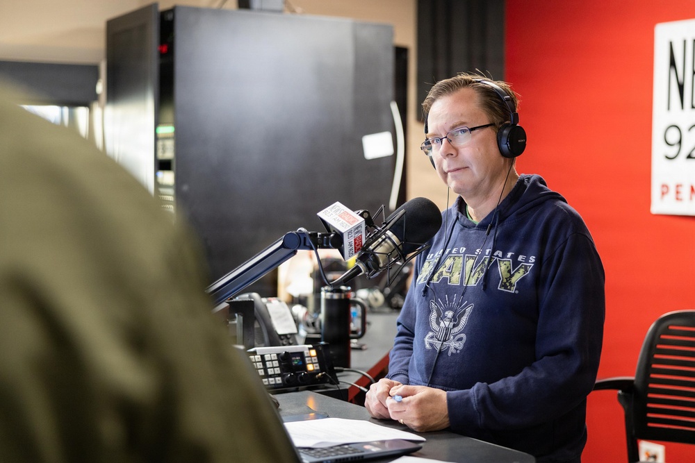 NETC Commander Rear Adm. Gregory Huffman conducts radio interview with NewsRadio 92.3