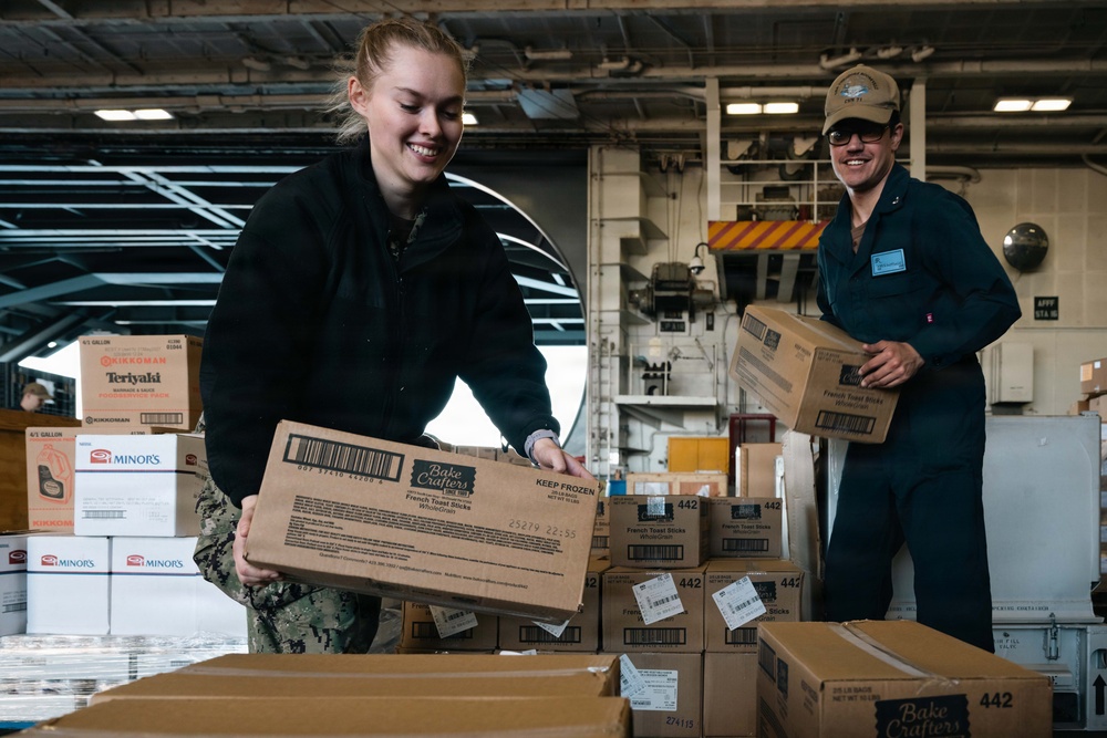 U.S. Navy Sailors Move Supplies