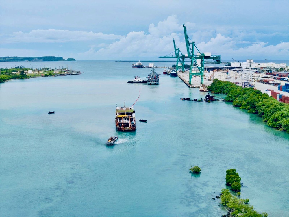 U.S. Navy, U.S. Coast Guard, Port of Guam refloat motor vessel Voyager